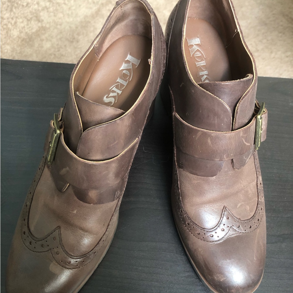 Used Korks buckle Wing tips. Size 8.5. 3” heel.
